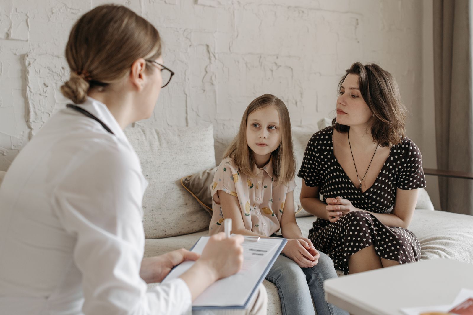 Doctor talking with a parent and child
